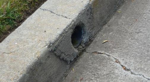 cracking curb thru curb drain