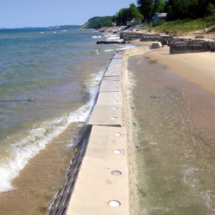 Waves crashing against Sandsaver Beach Erosion Solution
