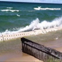Waves Crashing against Sandsaver Beach Erosion Barriers